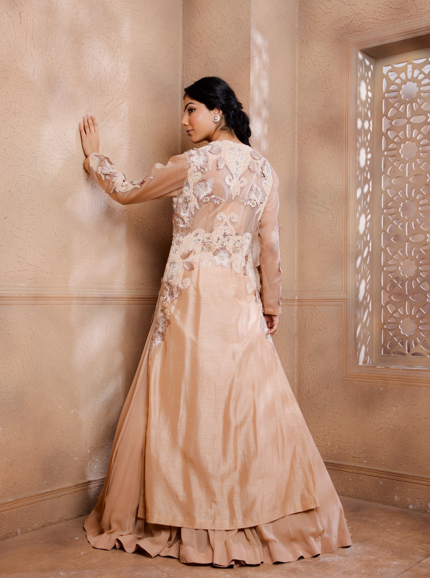 Drape yourself in this opulent jacket lehenga set.