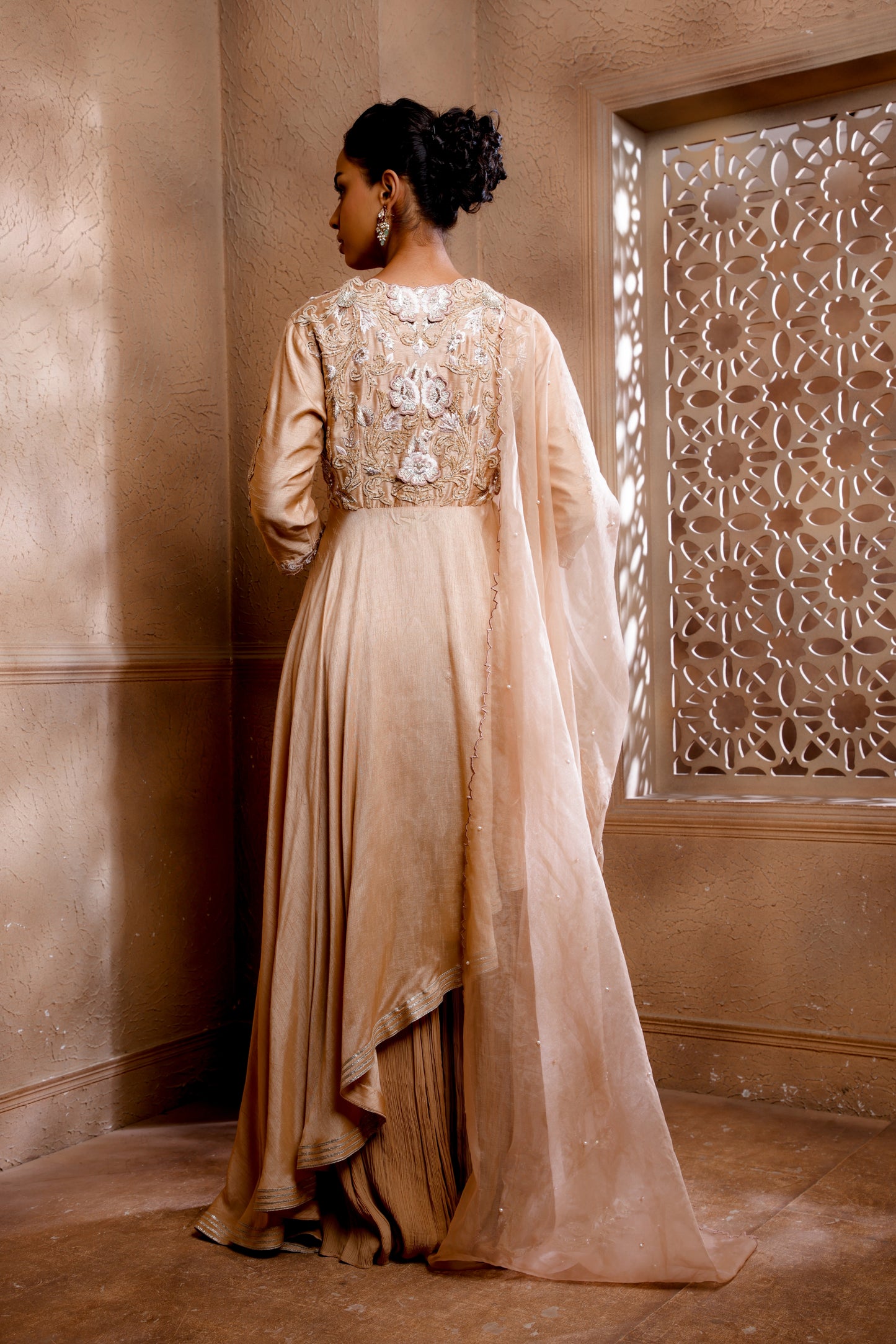 Asymmetrical Anarkali with beautiful Velvet Dori & 3D Embroidery paired with a sharara & heavy dupatta.