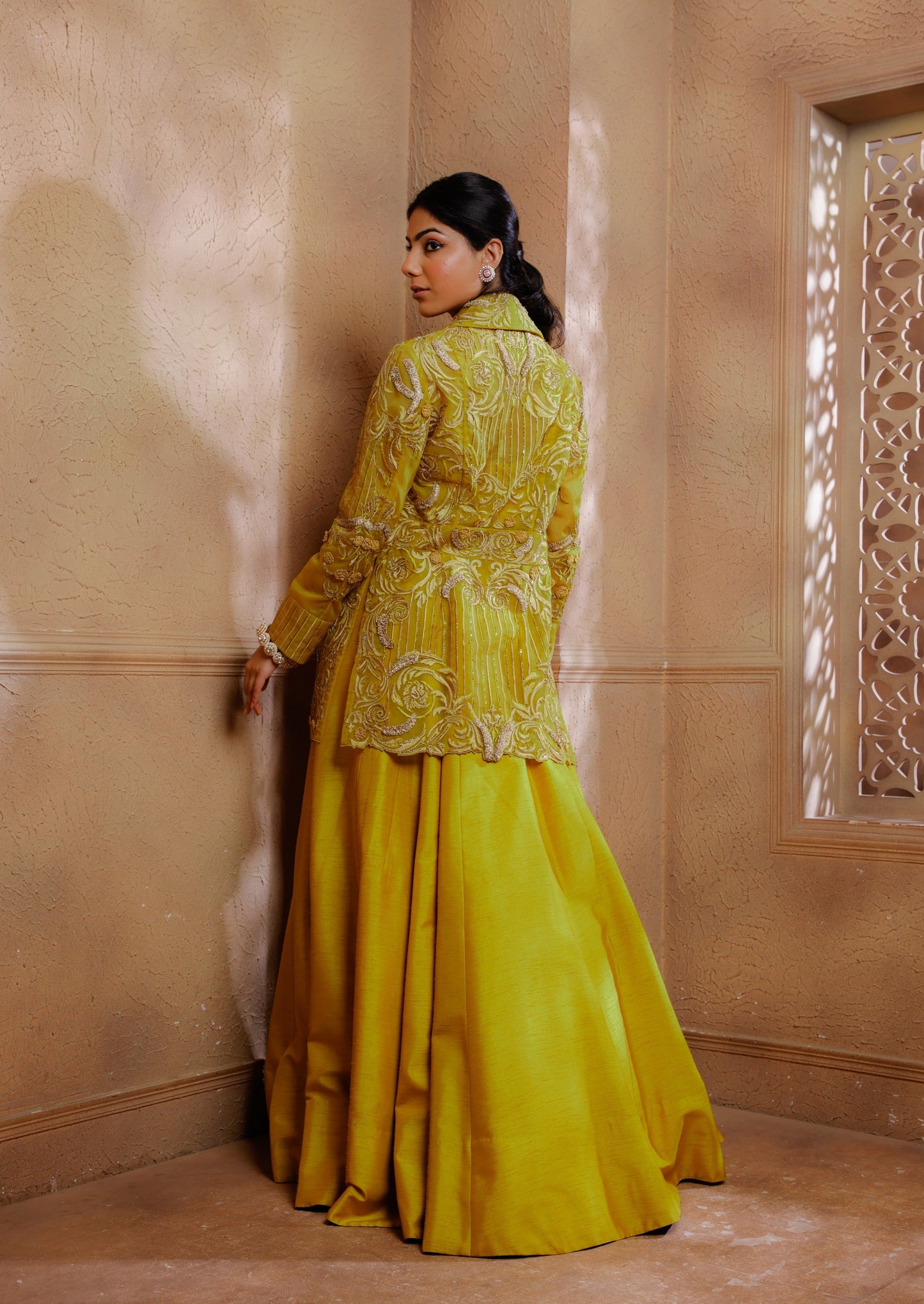 Delicate tonal embroidery adorns the jacket, creating a romantic and feminine allure paired with a blouse & lehenga.