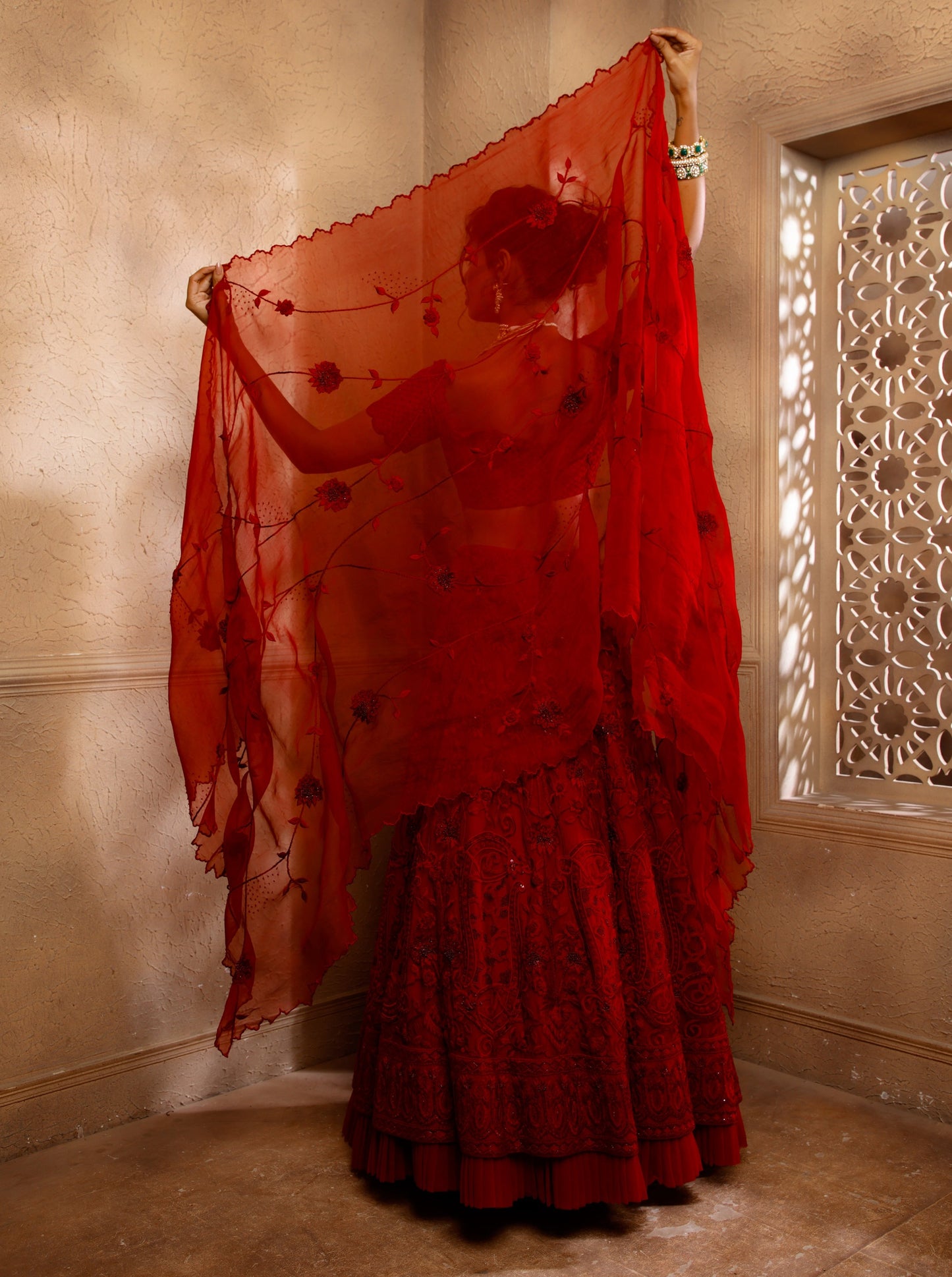 Our Crimson Royale Embroidered Red Lehenga Set, a breathtaking ensemble that seamlessly blends tradition with contemporary elegance
