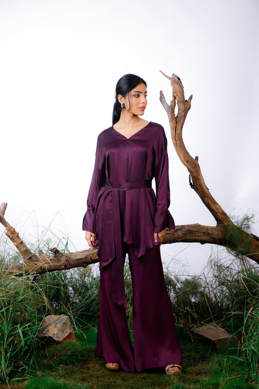 coord set is made in delicate silk satin with an oversized asymmetrical cut top paired with a bootleg trouser