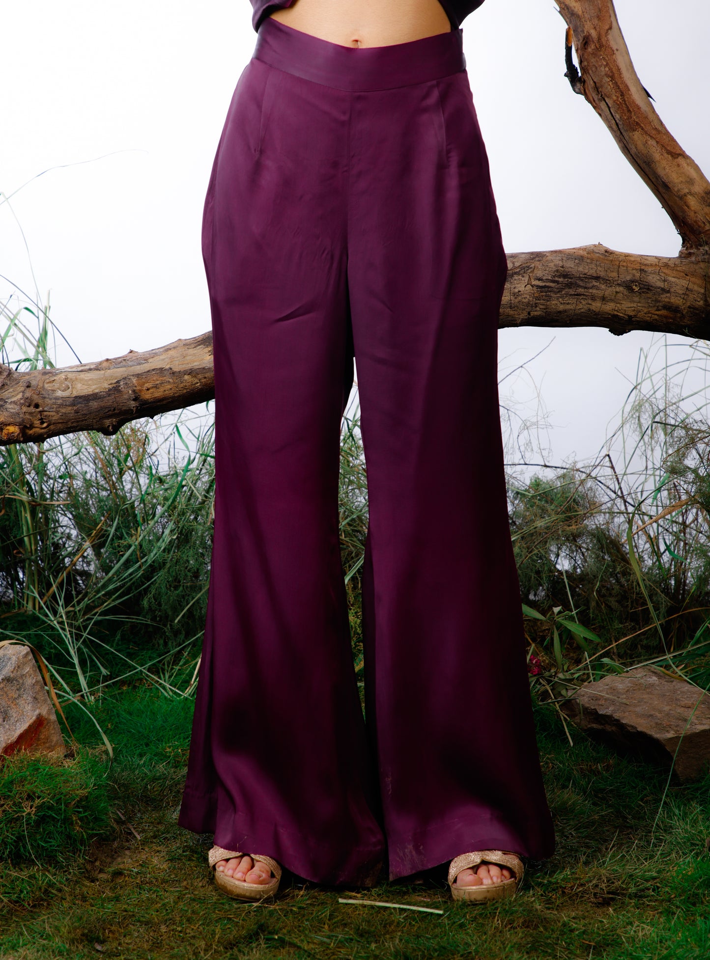 coord set is made in delicate silk satin with an oversized asymmetrical cut top paired with a bootleg trouser