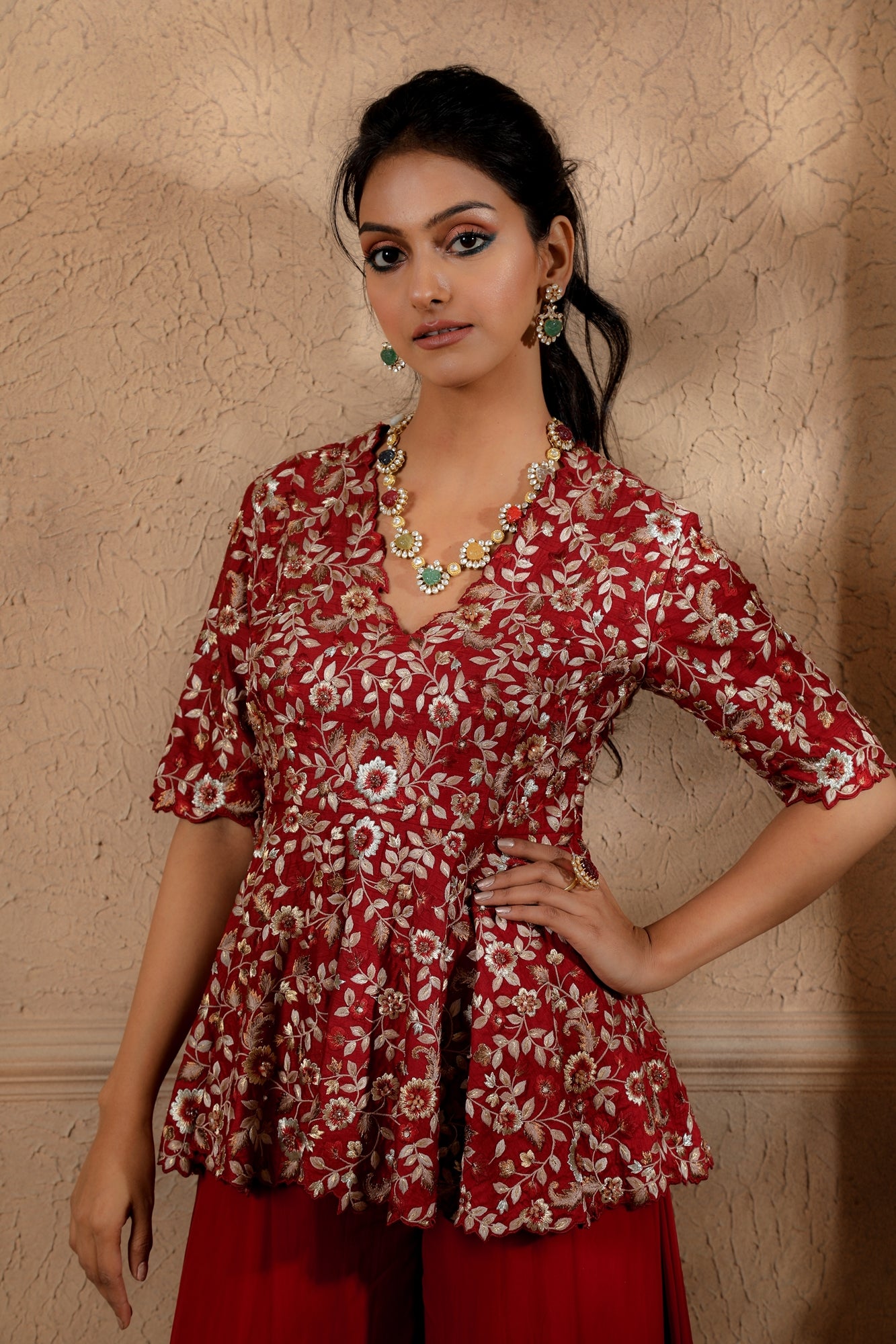 Red Floral Embroidered peplum with contrasting embroidery in hues of gold with an Organza Sharara.