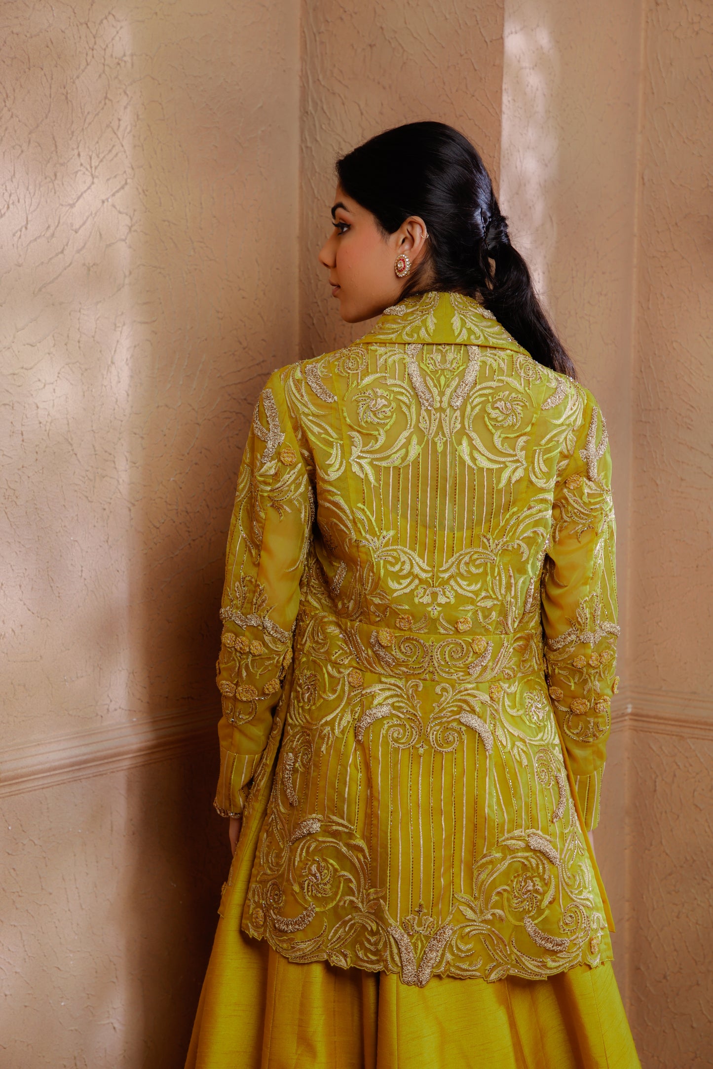 Delicate tonal embroidery adorns the jacket, creating a romantic and feminine allure paired with a blouse & lehenga.