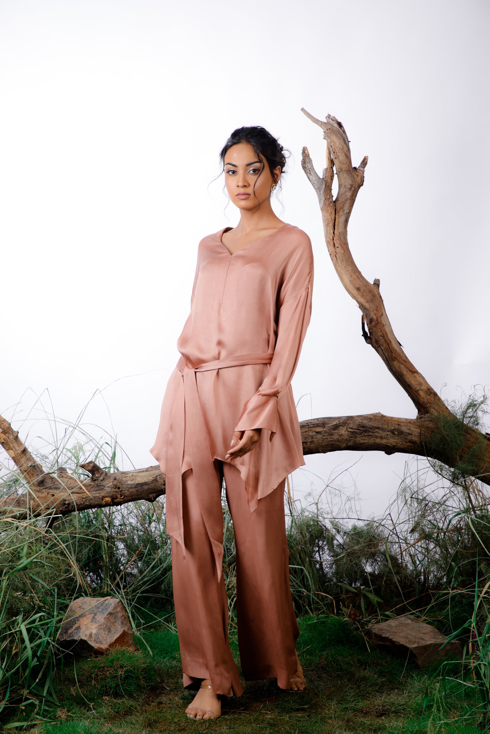 coord set is made in delicate silk satin with an oversized asymmetrical cut top paired with a bootleg trouser and a self fabric belt. Wear it with or without the belt.