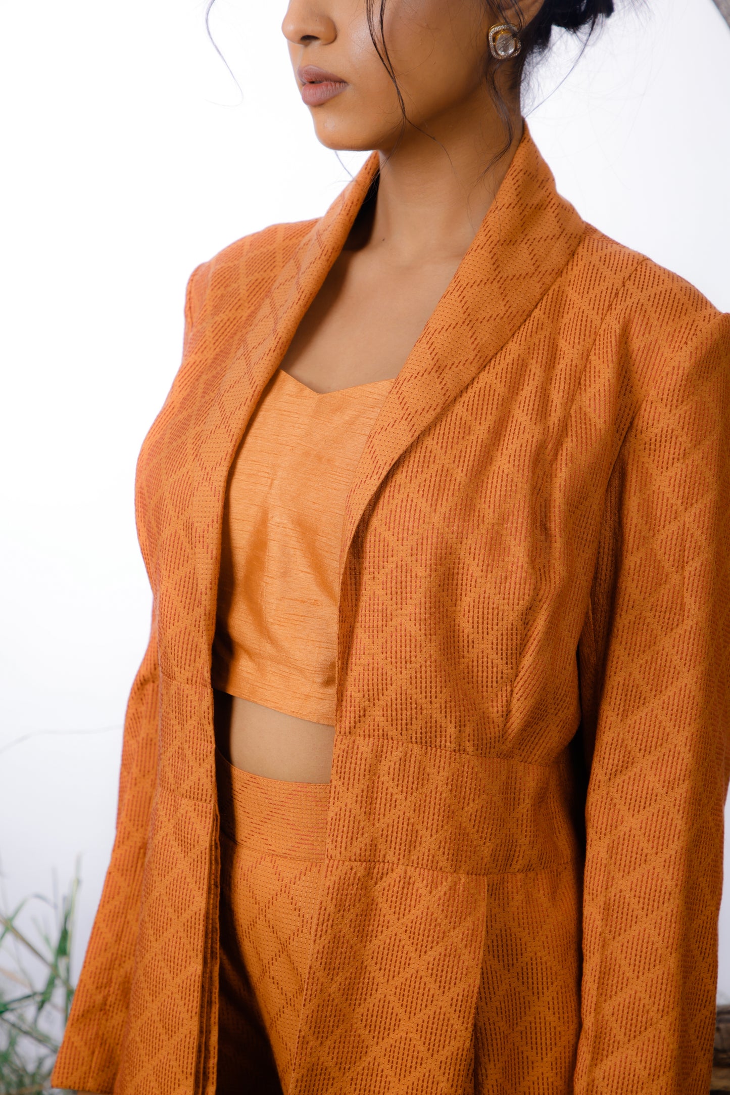 Don this Dobby Kantha embroidered Jacket and Trouser set with a complementary tonal crop top. 