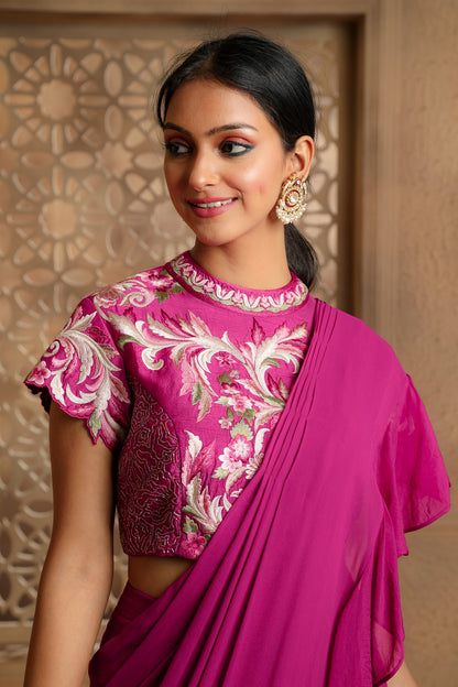 Pre-Draped Georgette Saree with Frill on the Pallu and a High neck Multi-color embroidered blouse with hand embroidery.